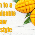 "A ripe mango on a wooden table, sunlight illuminating its vibrant color, symbolizing the start of a raw lifestyle journey."
